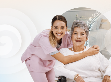 Carer and aged care resident hugging