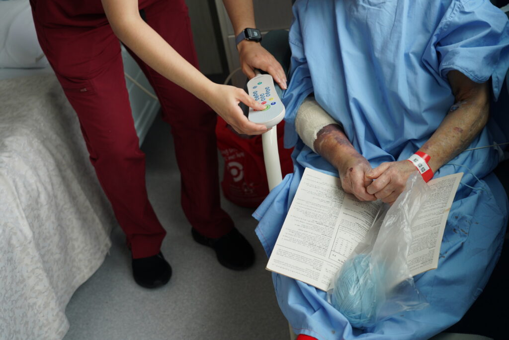 Nurse showing patient the responder nurse call handset