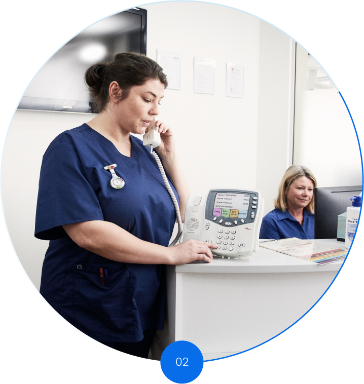 nurse using responder nurse call handset at the nursing station