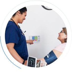 Nurse pressing nurse call buttons