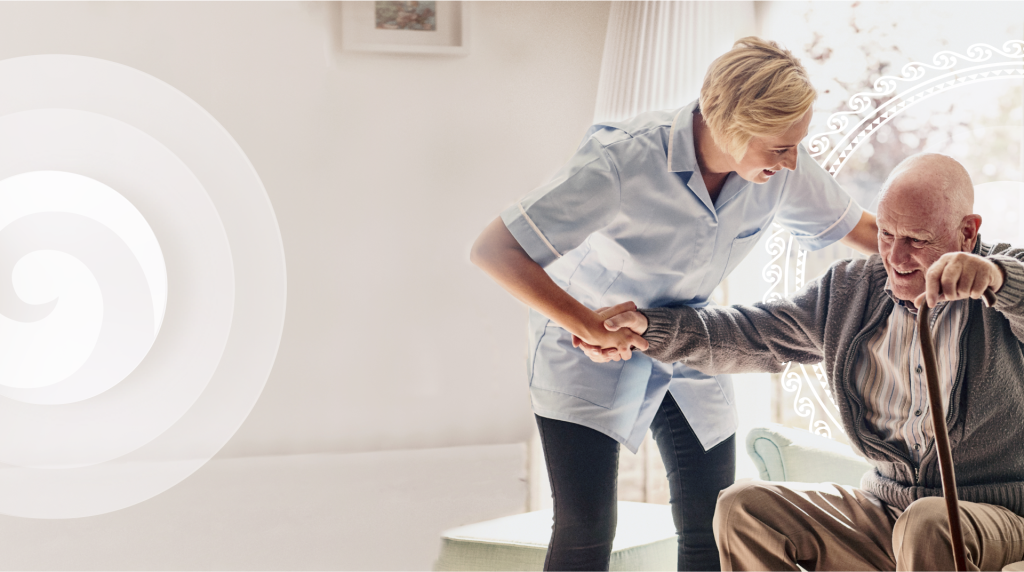 carer helping resident stand up