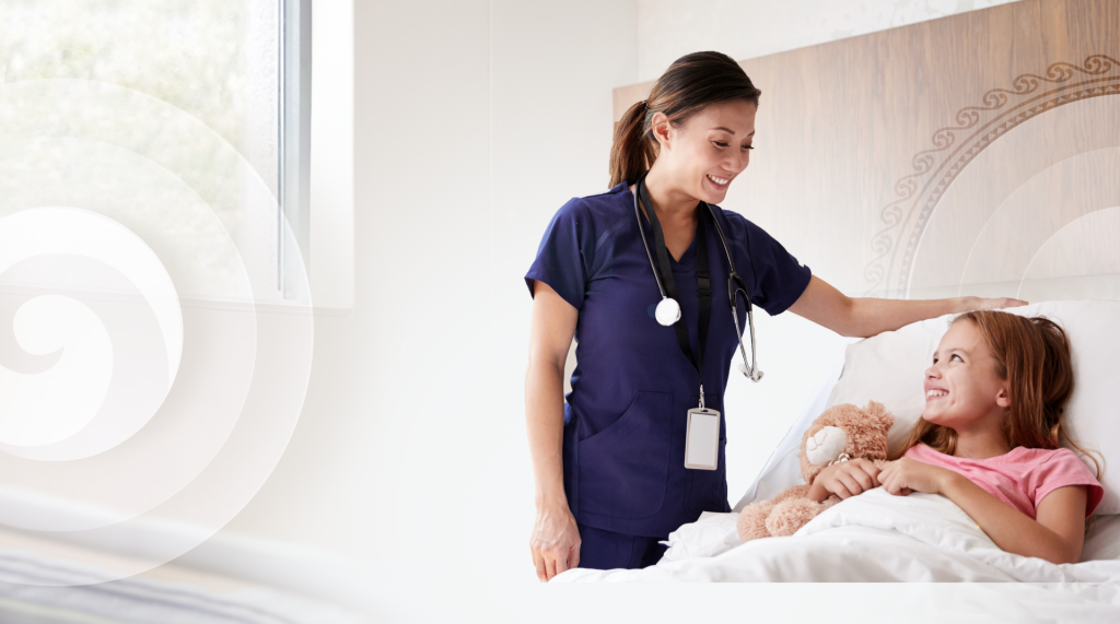 nurse smiling at young patient